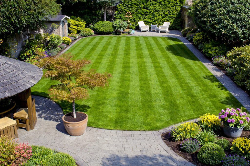 Professional garden maintenance results showing how proper spring garden tidy up improves lawns, borders and patios in Essex gardens
